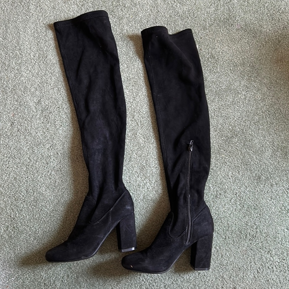 Knee high black heeled boots